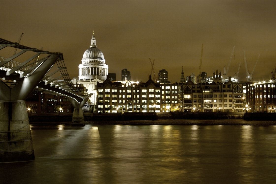 Background image of the London skyline at dusk, representing the financial and social impact focus of I For Change, and hinting at a London base